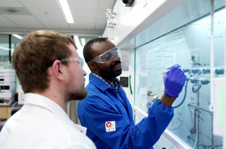 Samuel Awuah, Ph.D., right, works with teaching assistant Justin Holmes in the lab. Jeremy Blackburn | UK Research Communications