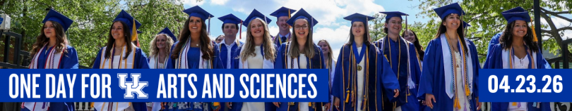 One Day for UK Arts and Sciences web banner featuring a group of smiling University of Kentucky graduates in blue caps and gowns walking outdoors on a sunny day, with text reading "ONE DAY FOR UK ARTS AND SCIENCES 04.23.26